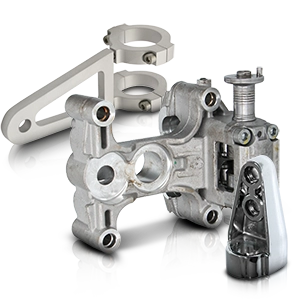 Various metal motorcycle mounts in silver, precisely milled and partially polished.
